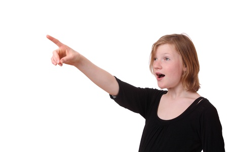 Girl points with her finger up on white backgroundの写真素材