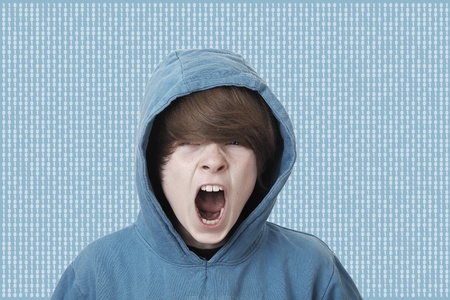 Screaming teenage boy caught in the matrixの写真素材