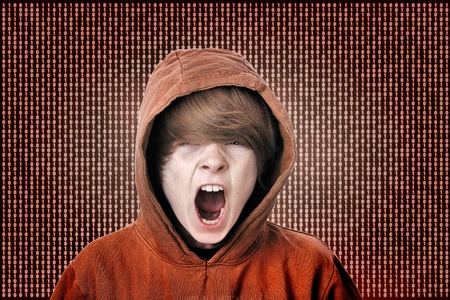 Screaming teenage boy caught in the matrixの写真素材