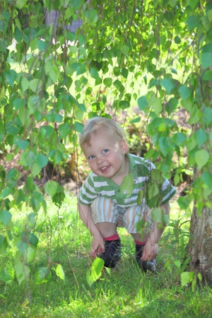 Little kid having fun in the gardenの写真素材