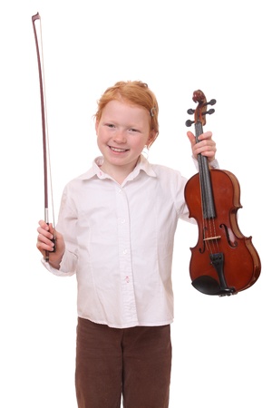 Portrait of a young girl holding a violin on white backgroundの写真素材