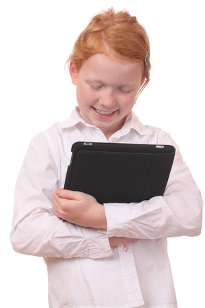 Portrait of a young girl with a tablet pc on white backgroundの写真素材