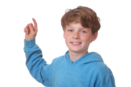 Young boy pointing index finger up on white backgroundの写真素材