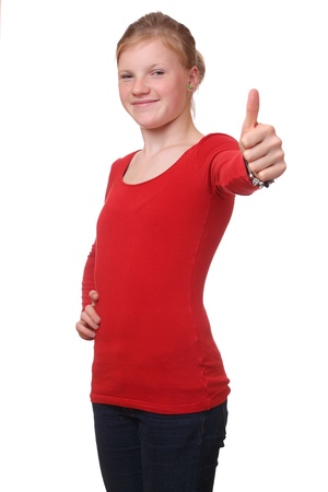 Young teenage girl with thumbs up on white backgroundの写真素材