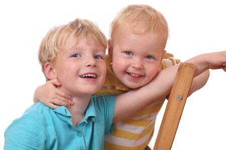 Two happy young kids on white backgroundの写真素材