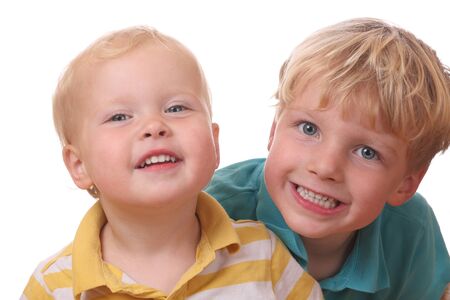 Two happy young kids on white backgroundの写真素材