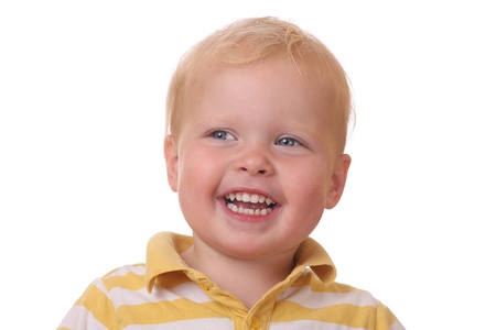 Portrait of a laughing young kid on white backgroundの写真素材