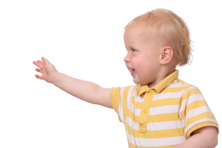 Young kid reaches out right arm on white backgroundの写真素材