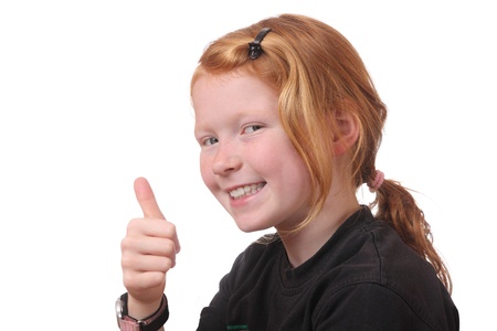 Smiling girl with thumbs up on white backgroundの写真素材