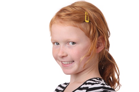 Portrait of a young redhaired girl on white backgroundの写真素材