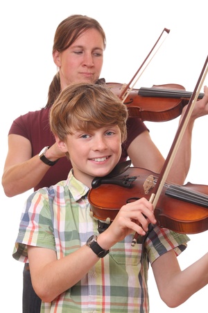 Woman and boy playing violin on white backgroundの写真素材