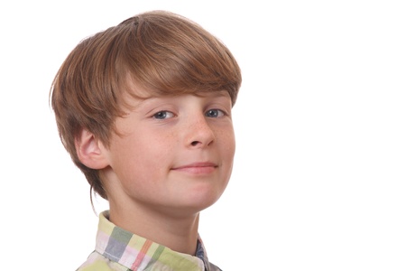 Portrait of a confident young boy on white backgroundの写真素材