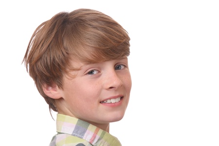 Portrait of a confident young boy on white backgroundの写真素材