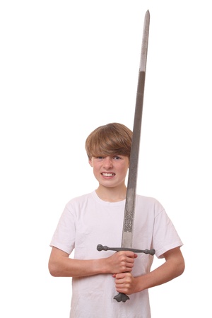 Young boy with a big sword on white backgroundの写真素材