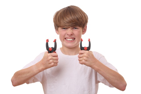 Young boy with spring loaded clamps on white backgroundの写真素材
