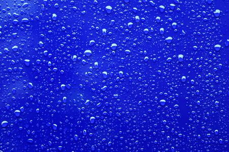 Raindrops on a blue backgroundの写真素材