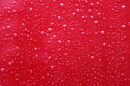 Raindrops on a red backgroundの写真素材