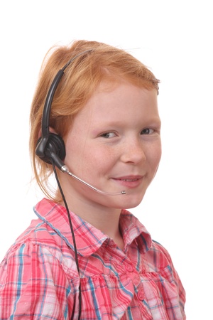 Young girl wearing a headset on white backgroundの写真素材