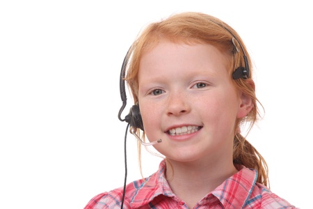 Young girl wearing a headset on white backgroundの写真素材