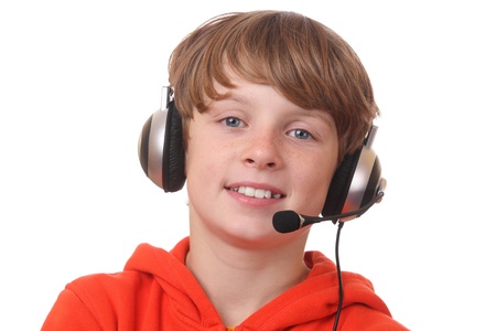 Young boy wearing headphone with microphone on white backgroundの写真素材