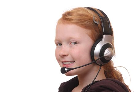 Young girl wearing headphone with microphone on white backgroundの写真素材