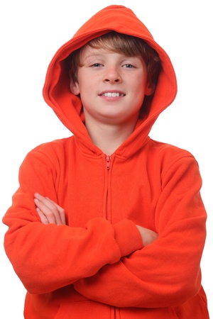 Young boy wearing an orange hoodie on white backgroundの写真素材