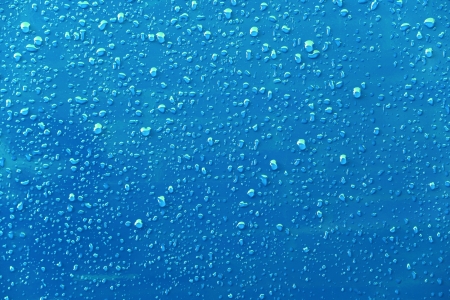 Raindrops on a blue backgroundの写真素材