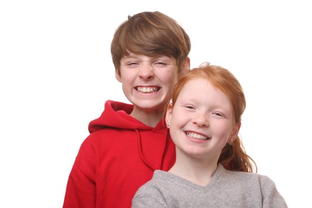 Two happy young children on white backgroundの写真素材