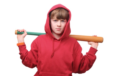 Young boy with a baseball bat on white backgroundの写真素材