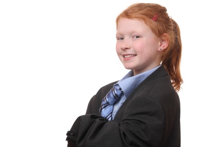 Young girl in an oversized business suit on white backgroundの写真素材