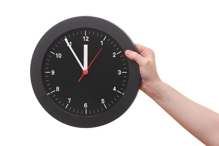Hand showing a clock on white backgroundの写真素材