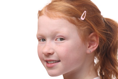 Portrait of a red haired young girl on white backgroundの写真素材