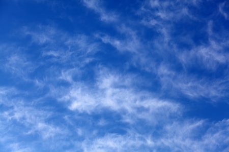 Blue sky with some white cirrus cloudsの写真素材