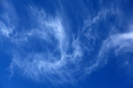 Blue sky with some white cirrus cloudsの写真素材