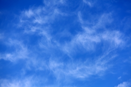 Blue sky with some white cirrus cloudsの写真素材