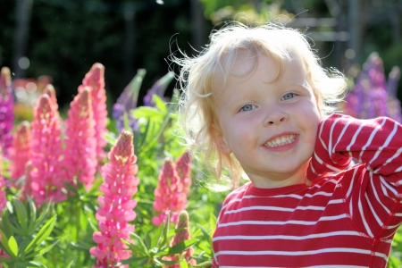 Happy young child in the gardenの写真素材