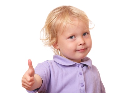 Portrait of a funny toddler with thumbs up on white backgroundの写真素材