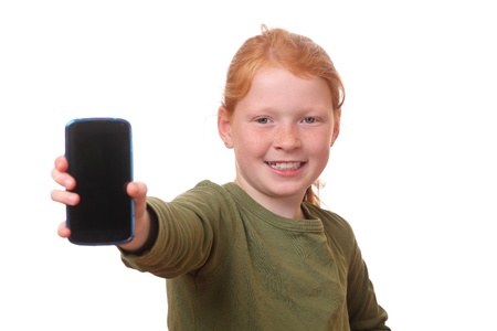 Happy young girl shows her new smartphoneの写真素材