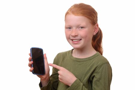 Happy young girl shows her new smartphoneの写真素材