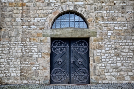 Ancient wooden door in an old castleの写真素材