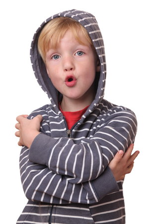 Portrait of a funny young boy on white backgroundの写真素材