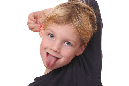 Portrait of a funny young boy on white backgroundの写真素材