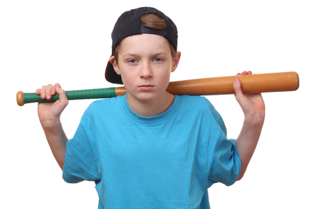 Portrait of a young baseball player on white backgroundの写真素材