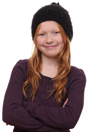 Portrait of a beautiful red-haired girl on white backgroundの写真素材