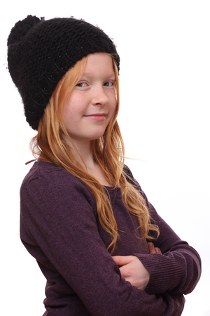 Portrait of a beautiful red-haired girl on white backgroundの写真素材