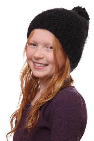 Portrait of a beautiful red-haired girl on white backgroundの写真素材