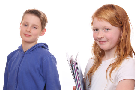 Portrait of happy girl and boy on white backgroundの写真素材