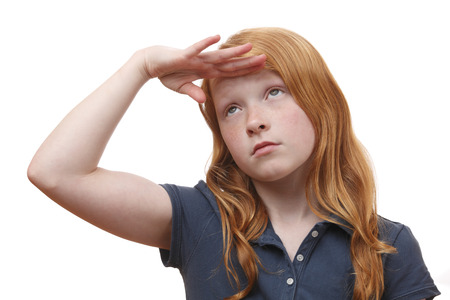 Portrait of a searching young girl on white backgroundの写真素材
