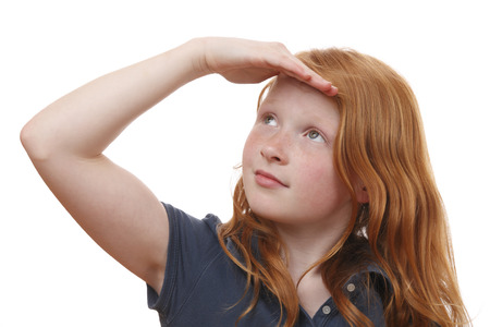 Portrait of a searching young girl on white backgroundの写真素材