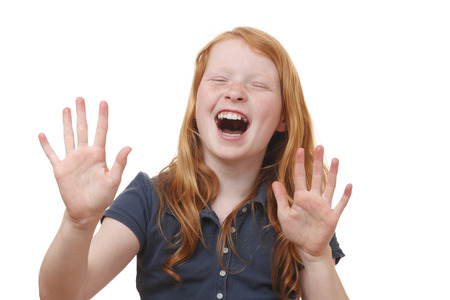 Portrait of a screaming young girl on white backgroundの写真素材